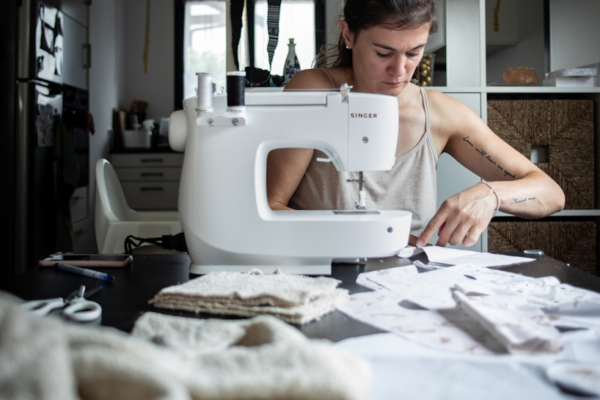 woman sewing at table